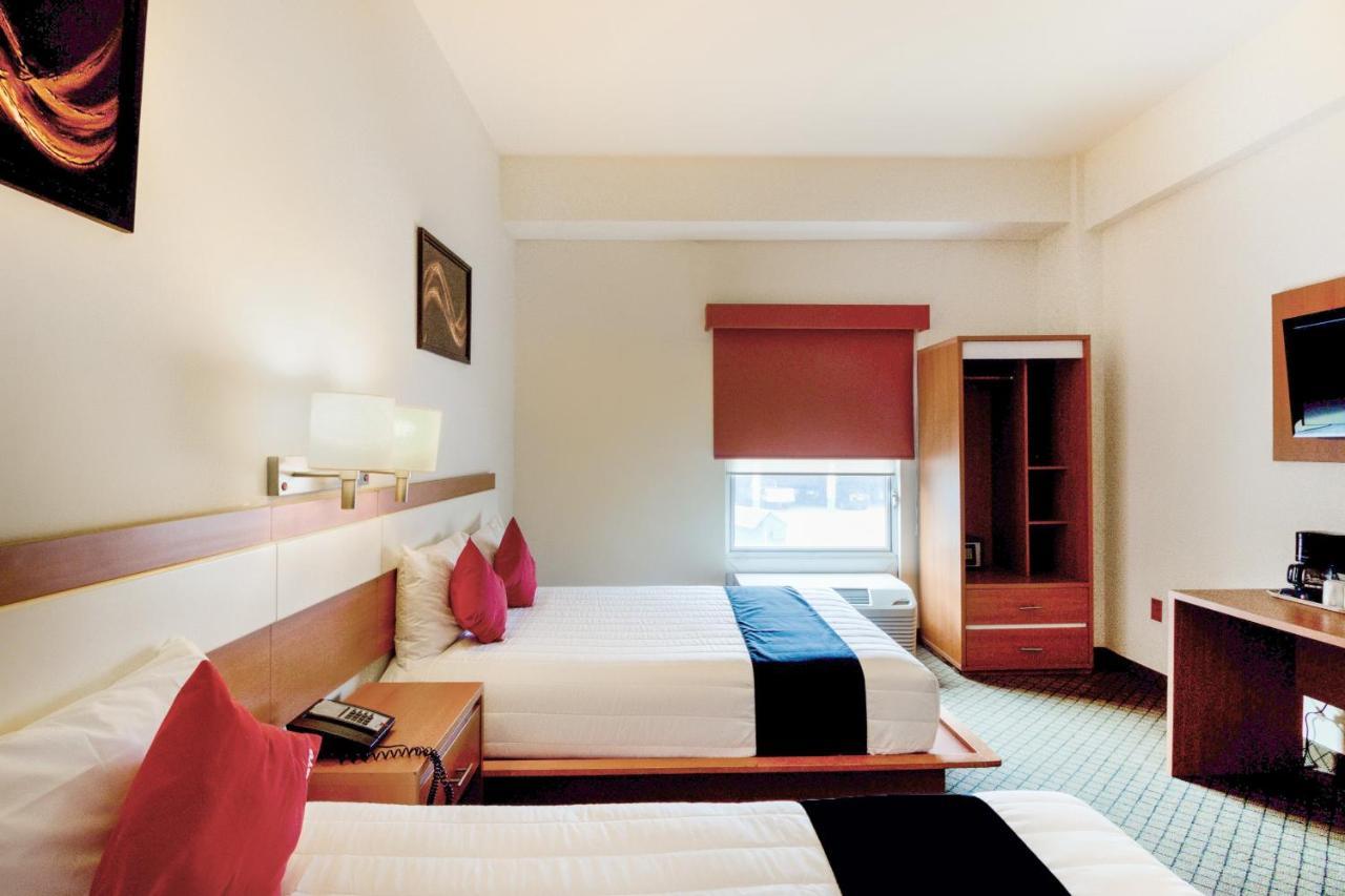 Capital O Hotel Herederos, Пьедрас-Неграс Экстерьер фото